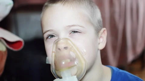 Boy Cold and Began to Cough. it Makes Inhalation Via Nebulizer With Medication Stock Footage 62022572