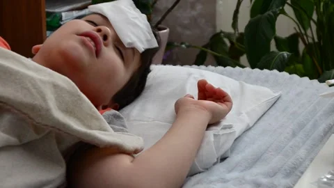 A boy with a cold is at home, treated. medicines, medicine, throat nose spray 库存影片 148767798