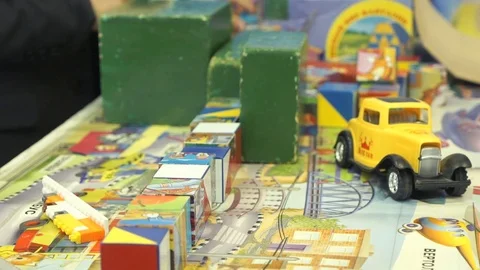 Boy collects a figure with a pattern using cubes Video stock 77657629