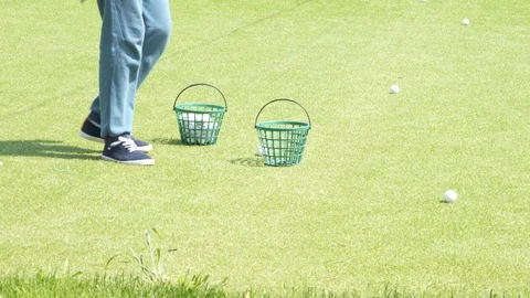 The boy collects golf balls Stock Footage 78775739