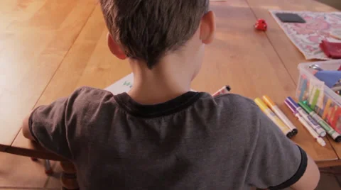Boy Coloring a Picture from Behind Video stock 34480652