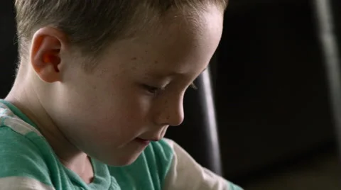 Boy Coloring, Tilt to Face Stock Footage 62774714