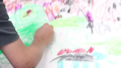 Boy colours in drawing of dinosaur Stock Footage 137959720