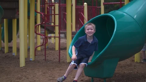 Boy Coming out of a Slide Stock Footage 91624030