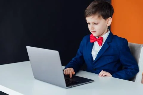 Boy at the computer in the classroom learning online school IT programming Stock Photos