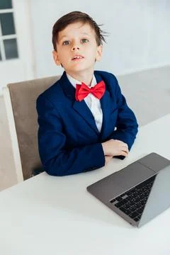 Boy at the computer in the classroom learning online school IT programming Photos
