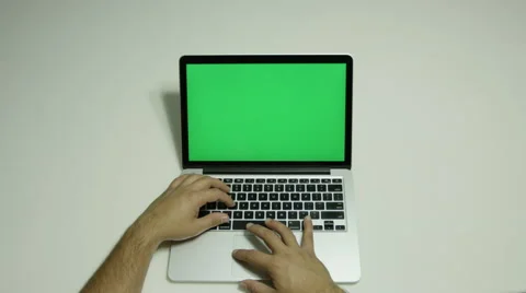 Boy on a computer trying with a green screen  Stock Footage 68500955