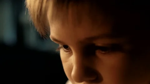 The boy is concentrating on the opponent's move during a chess game. Portrait Stock Footage 156708265