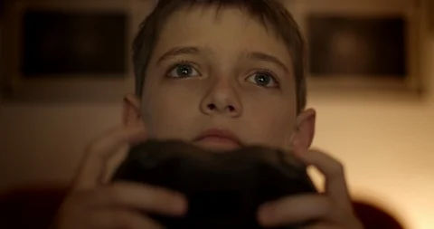 Boy concentrating on video game console. Stock Footage 127816001