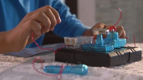 The boy conducts an experiment in physics Video stock 97137135