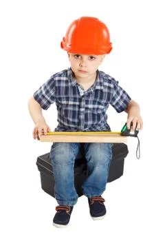 Boy in the construction helmet Stock Photos