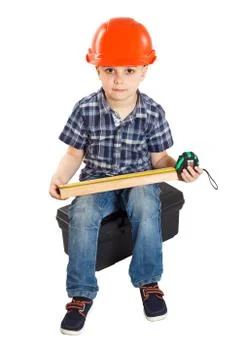 Boy in the construction helmet Stock Photos