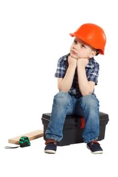 Boy in the construction helmet Stock Photos