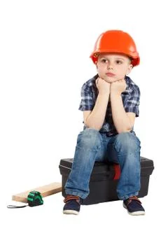 Boy in the construction helmet Stock Photos