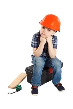 Boy in the construction helmet Stock Photos
