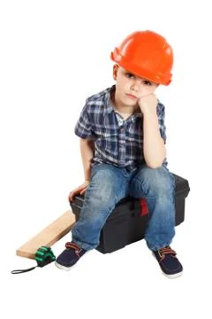 Boy in the construction helmet Stock Photos