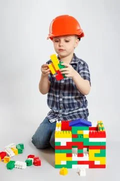 Boy in the construction helmet Stock Photos