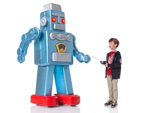 Boy controlling a giant robot Stock Photos