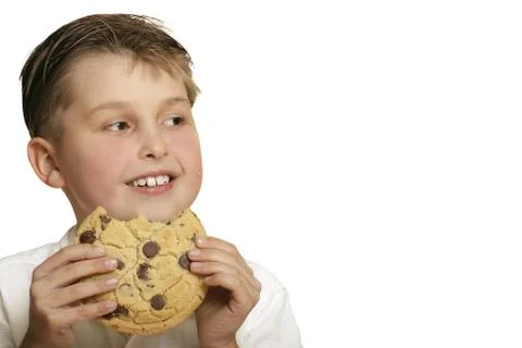 Boy with cookie Stock Photos