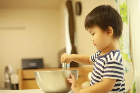 Boy cooking Stock Photos
