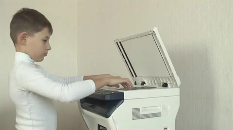Boy copy documents on Xerox Video stock 61099310