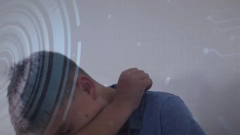 Boy coughing into elbow sensing irritation as UI and code overlays swirling Stock Footage 318237166