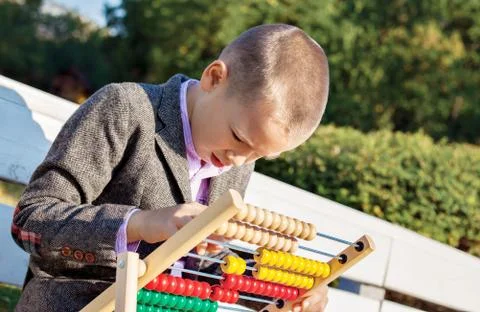 Boy counting abacus Stock Photos