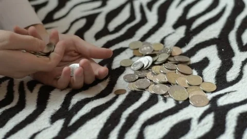 Boy counting coins, child puts money in a piggy bank, kid saving money Stock Footage 71342597