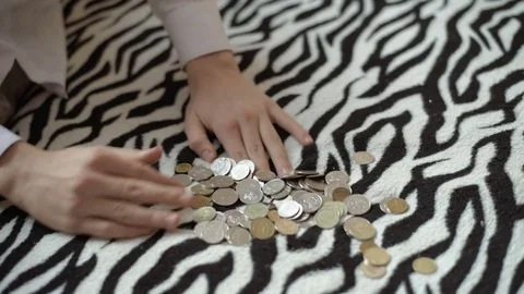 Boy counting coins, child puts money in a piggy bank, kid saving money Stock Footage 71342607