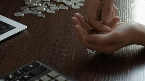 Boy counting of small change coins Stock Footage 71342388