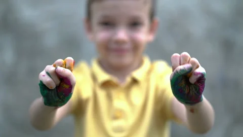 a child painting with finger paints, Stock image