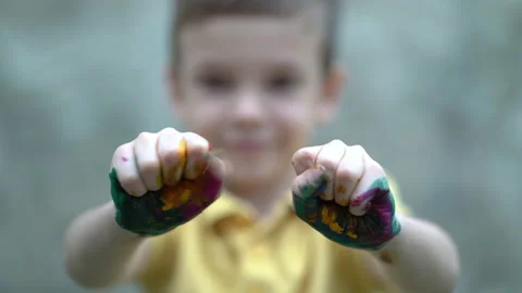 Boy covered in finger paint. Stock Footage 158856607