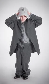 Boy covered papers Stock Photos