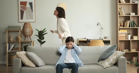 Boy Covering Ears to Block Out Mother Scolding Stock Footage 254441305