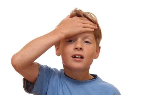 Boy covers his forehead Stock Photos