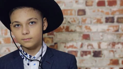 A boy in a cowboy hat smiles Stock Footage 147389915
