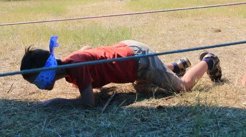 Boy crawling, sneaking under the ropes. Let. Stock Footage 51614041