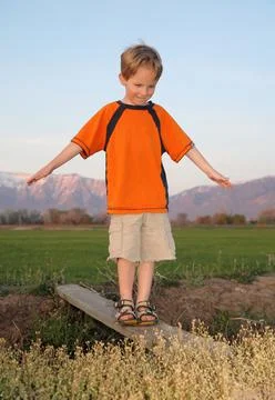 Boy crossing bridge Stock Photos
