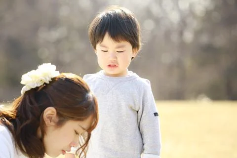 Boy crying with mother Stock Photos