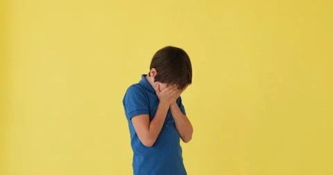 Boy crying over yellow background Stock Footage 145235948