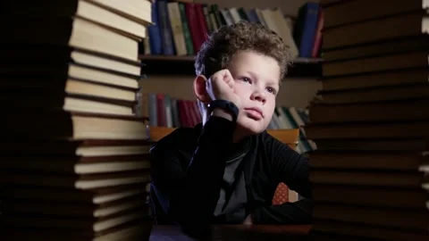 Boy curly doesn't want to learn facepalm Stock Footage 146061159