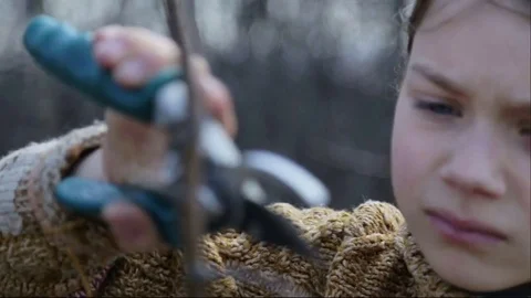 The boy cuts the trees in the garden with a pruner. Stock Footage 73934814