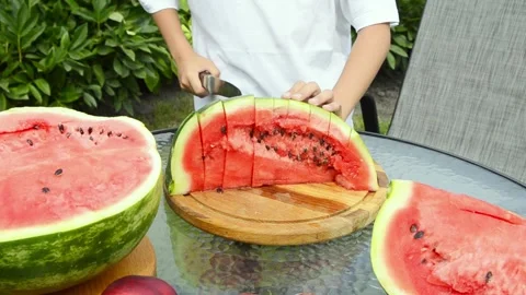 Boy Cutting Fresh Watermelon Into Pieces Stock Footage 341811708