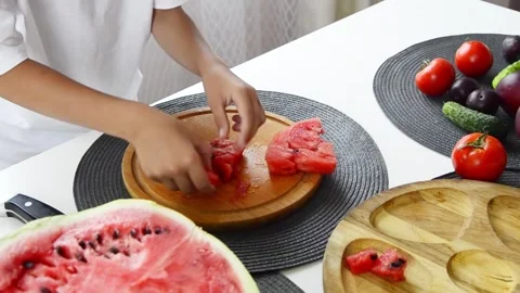 Boy Cutting Fresh Watermelon Into Pieces Stock Footage 341812160