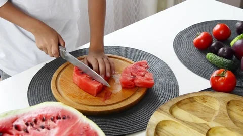 Boy Cutting Fresh Watermelon Into Pieces Stock-Footage 341812164