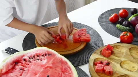 Boy Cutting Fresh Watermelon Into Pieces Stock Footage 341812167