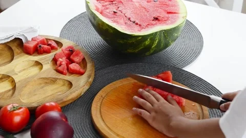 Boy Cutting Fresh Watermelon Into Pieces Video stock 341812177