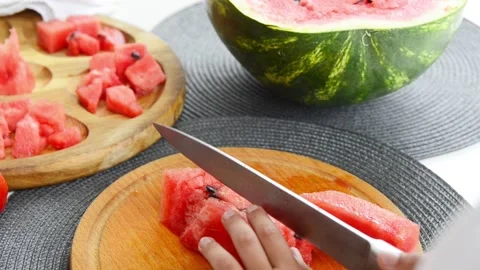 Boy Cutting Fresh Watermelon Into Pieces Stock Footage 341812227