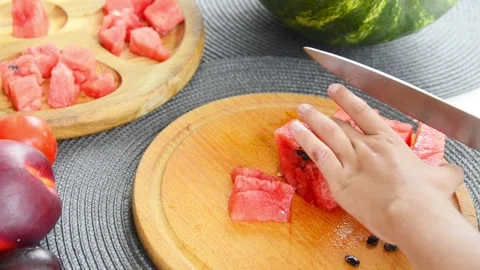 Boy Cutting Fresh Watermelon Into Pieces Stock Footage 341812232