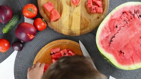 Boy Cutting Fresh Watermelon Into Pieces Stock Footage 341812384
